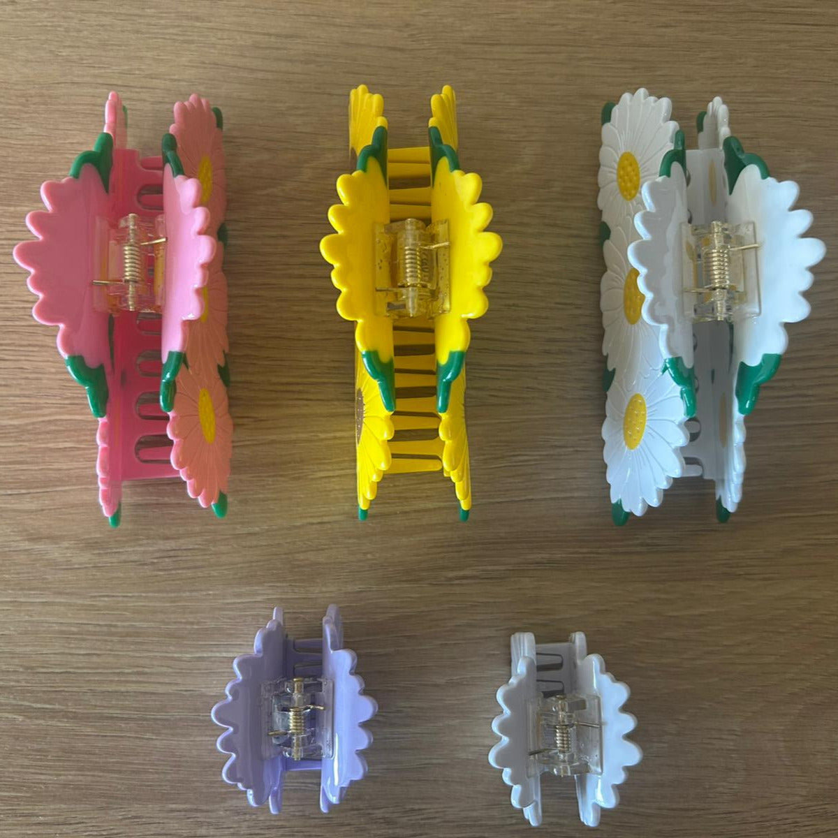 All Daisy Bunch Hair Claws Together Laying Straight Organized Next to One Another - Top View